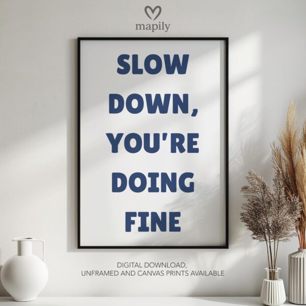 Sleek and stylish framed wall print featuring a bold, artistic statement Slow Down, perfect for modern decor lovers