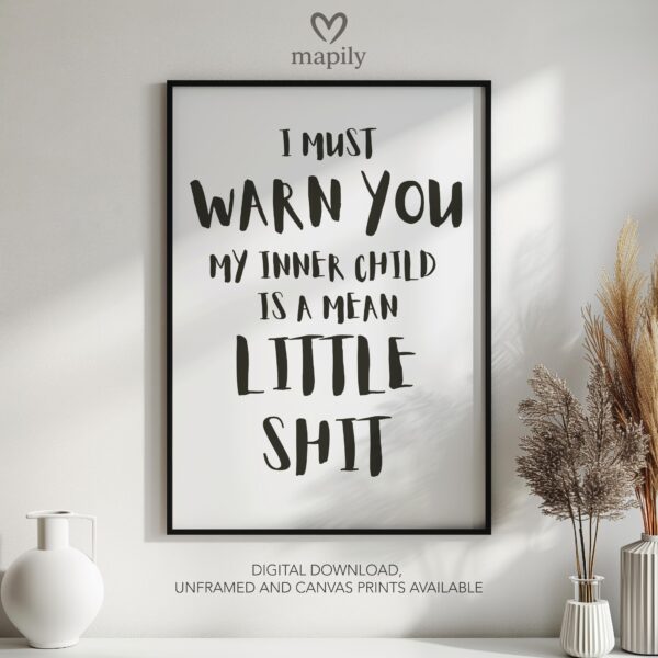 Simple and striking black and white quote print I Must Warn You My Inner Child Is A Mean Little Shit, designed for effortless styling