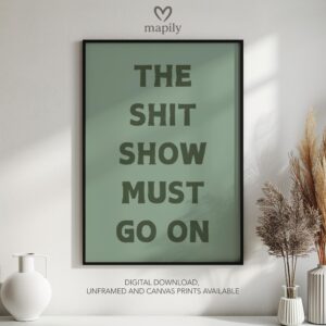 Graphic statement print The Shit Show Must Go On with a minimalist layout and modern flair
