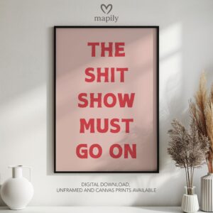 Framed quote artwork The Shit Show Must Go On with clean lines and a modern visual balance